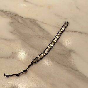 Leather and silver bracelet.